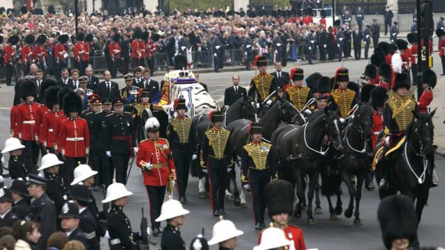 Prince Charles, Prince Philip, Prince Harry and Prince William walk behind the coffin of the Queen Mother in 2002 as it arrives at Westminster Abbey