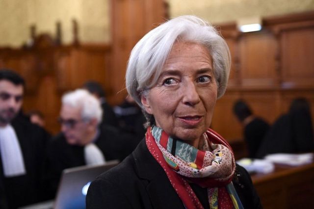 International Monetary Fund chief Christine Lagarde, right, arrives at the special Paris court, France, 12 December