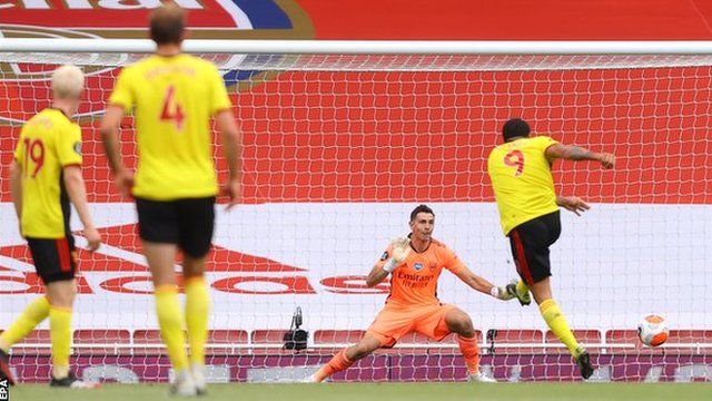 Troy Deeney scores a penalty for Watford against Arsenal