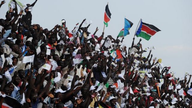 South Sudan football fans waving flags