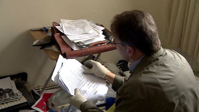 A council officer looks through paperwork