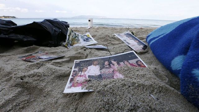 Photos and other belongings of refugees on the beach