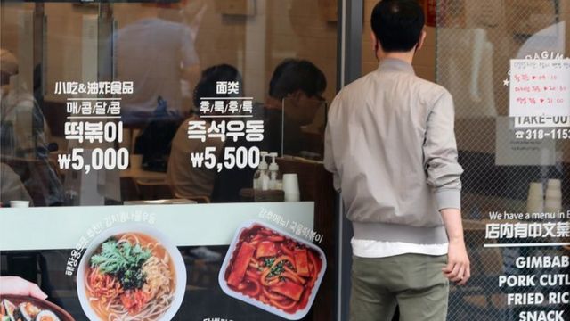 man entering a restaurant