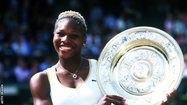 Serena Williams lifts the Wimbledon trophy in 2002.