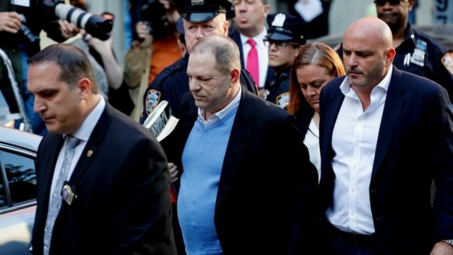Harvey Weinstein arrives at the police station in New York