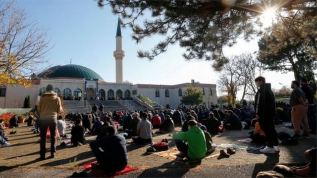 Muslims pray for the victims of the Vienna attack in front of a mosque in Medina, November 6, 2020