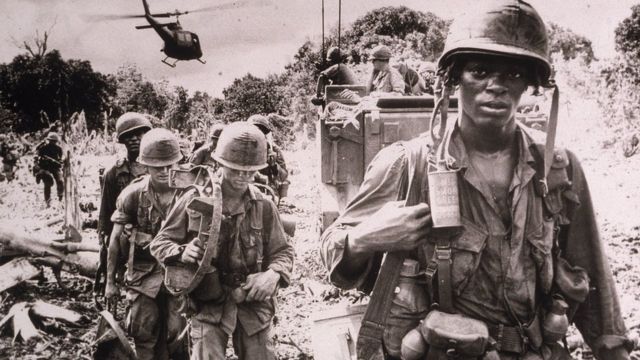 After receiving a fresh supply of ammunition and water flown in by helicopter, men of the US 173rd Airborne Brigade continue on a jungle 'Search and Destroy' patrol in Phuc Tuy Province, Vietnam, June 1966.