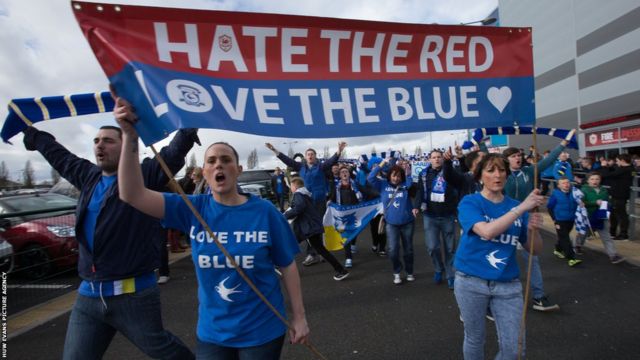 Thousands of Cardiff City fans march against club's blue to red rebrand -  BBC News
