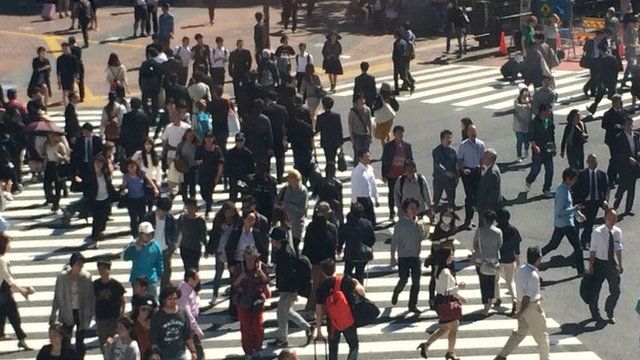 Tokyo street crossing with many people walking