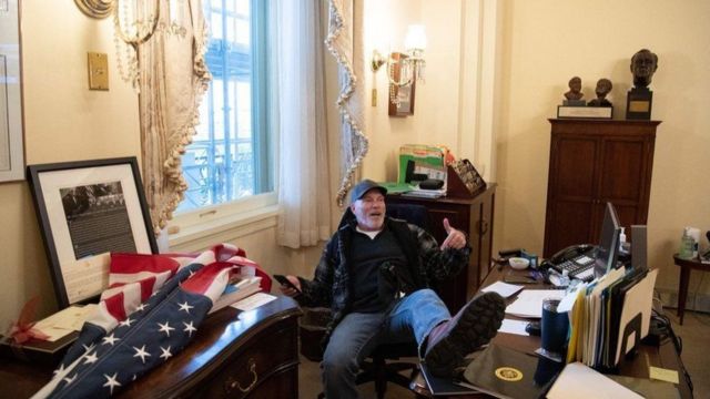 Barnett was photographed laying his foot on the desk of U.S. House Speaker Nancy Pelosi