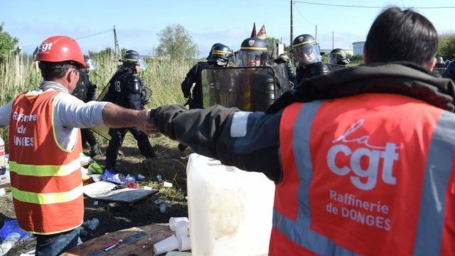 French union strikers and riot police
