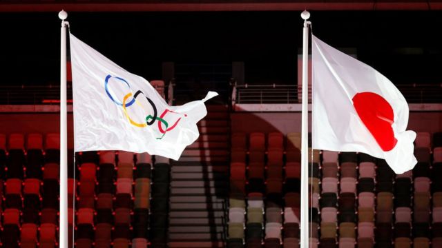 IOC and Japan flags.