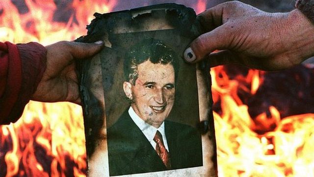 A photo of Nicolae Ceaușescu ready to be burned during the December 1989 Romanian revolution