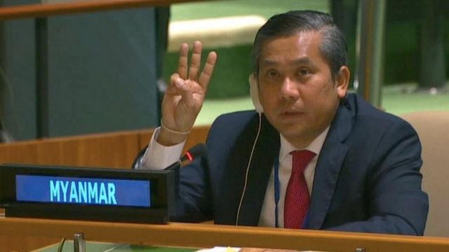 Myanmar's ambassador to the United Nations Kyaw Moe Tun holds up three fingers