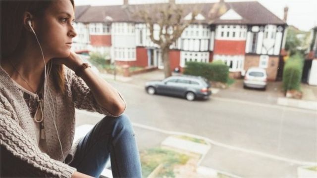 A woman looking out the window