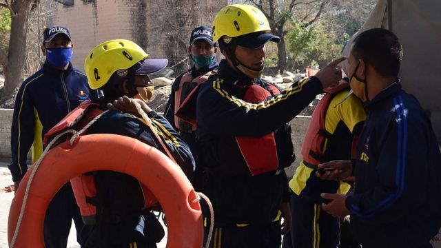 Image shows rescue workers in the region prepare for deployment