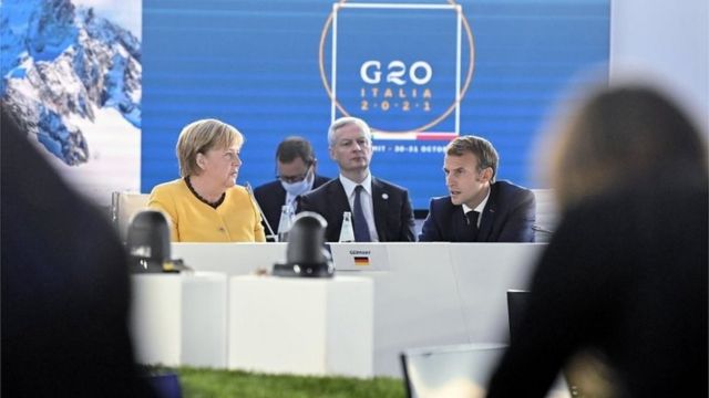 Angela Merkel e Emmanuel Macron em plenária do G20
