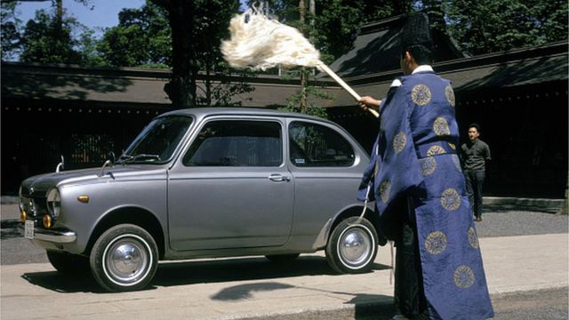 Japanese Shinto priest blesses a car