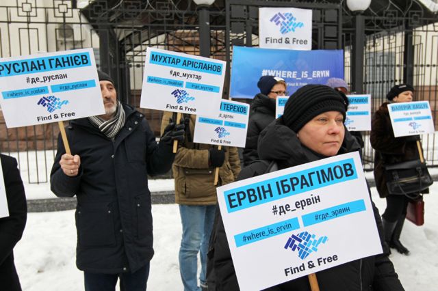KIEV, UKRAINE - 2018/12/27: Ukrainian protesters are seen holding placards during the protest. Protesters held placards with the names of missing Crimean activists during the rally demanding for an investigation for the disappearance of Crimean Tatar activist Ervin Ibragimov and pro-Ukrainian activists who went missing since the annexation of Crimea by Russia in 2014. According to local media 44 people were kidnapped and 15 of them have not yet been found since the 2014 in the annexed Crimea.