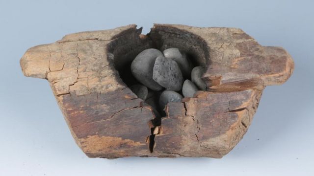 A wooden brazier and burnt stones from an archaeological site in western China that provided evidence for the burning of cannabis at a cemetery locale roughly 2,500 years ago, is shown in this image from the Pamir Mountains in Xinjiang region, released from Beijing, China, on June 12, 2019