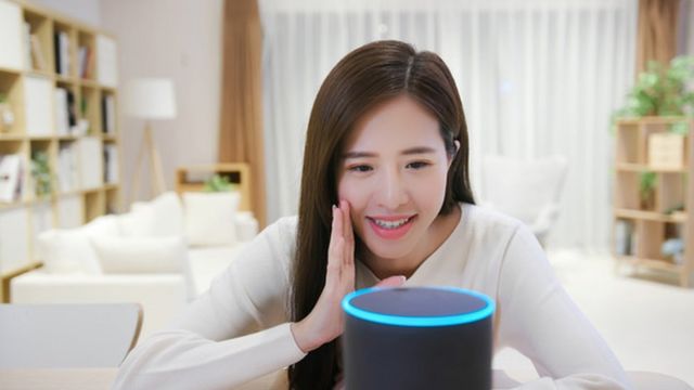 Woman talking to Alexa