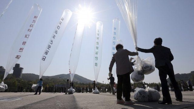 South Korean activists hold a balloon containing anti-North Korea leaflets
