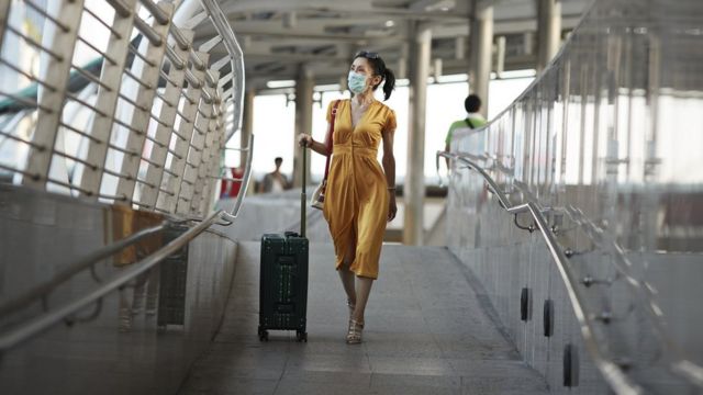 woman in mask at airport