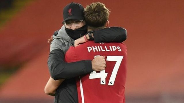 Jurgen Klopp hugs Nathaniel Phillips