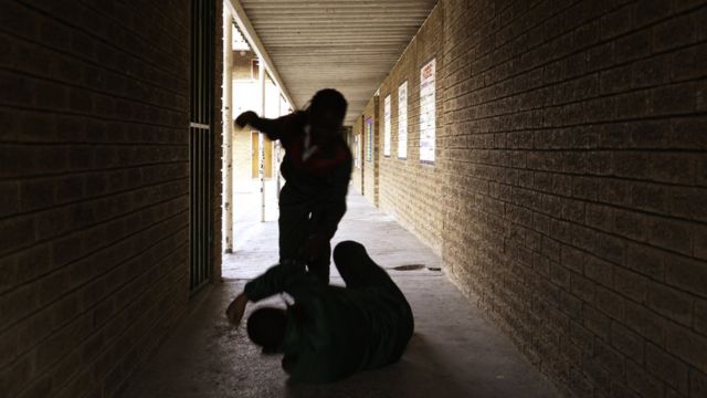 Person being beaten in hallway
