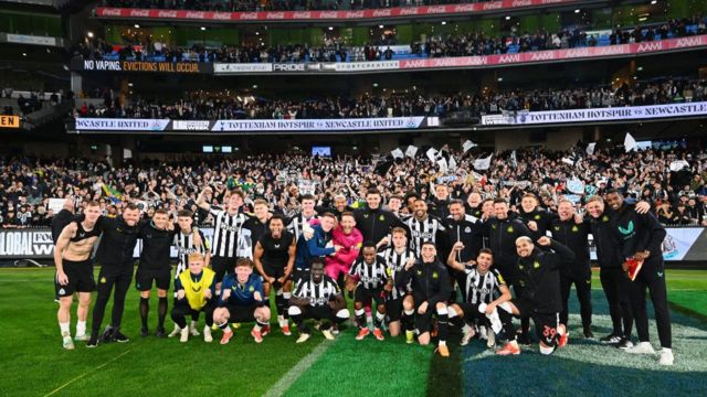Newcastle United FC players and staff pose for a team photo following the exhibition match between Tottenham Hotspur FC and Newcastle United FC at Melbourne Cricket Ground on May 22, 2024 in Melbourne