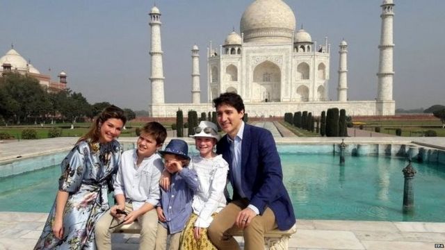 Canadian Prime Minister Justin Trudeau (R), accompanied by his wife Sophie Gregoire Trudeau (L) and their children pose for photographs at the landmark Taj Mahal in Agra, India, 18 February 2018.