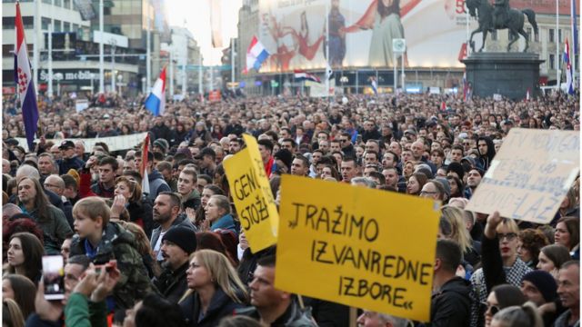 Demonstrators hold placards as they gather to protest against coronavirus disease (COVID-19) measures, in Zagreb, Croatia November 20, 2021