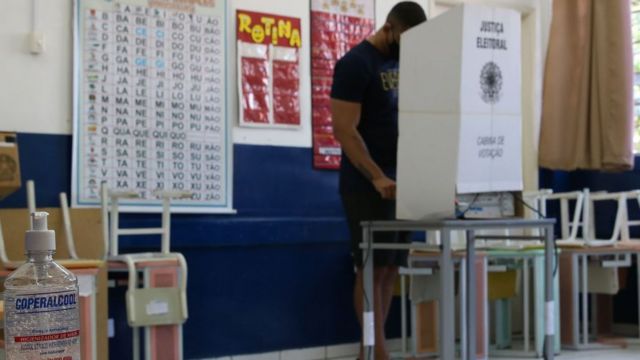 Man in voting booth