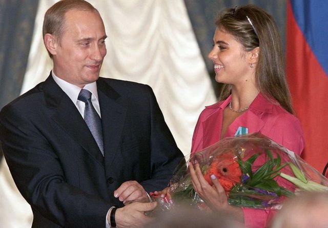 Putin and Kabaeva at a ceremony in 2001