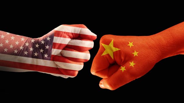 Fists decorated with the American and Chinese flags