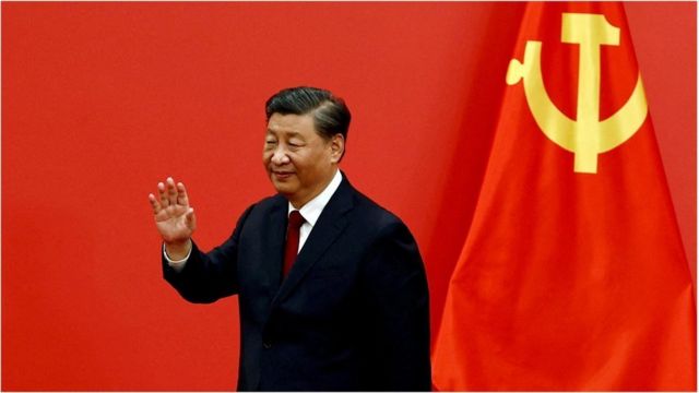 Chinese President Xi Jinping waves at the Great Hall of the People in Beijing, China