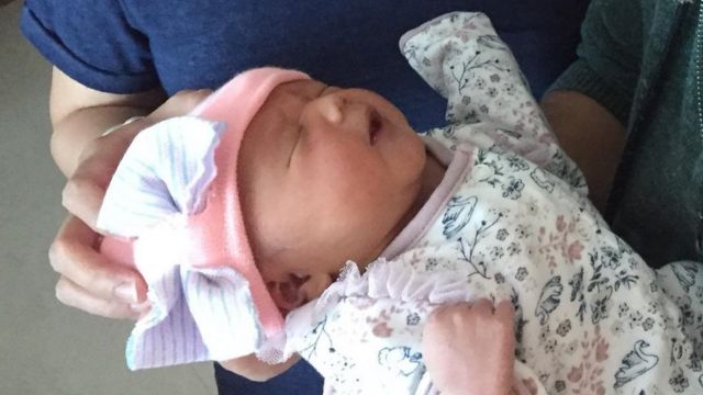 A new born baby girl.