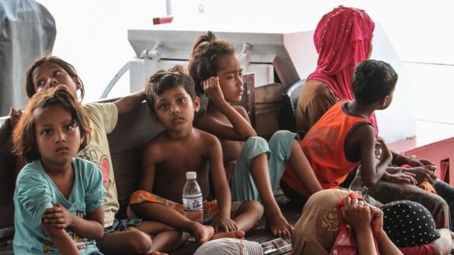 Rohingya refugees detained in Malaysia territorial waters off the island of Langkawi arrive at a jetty in Kuala Kedah