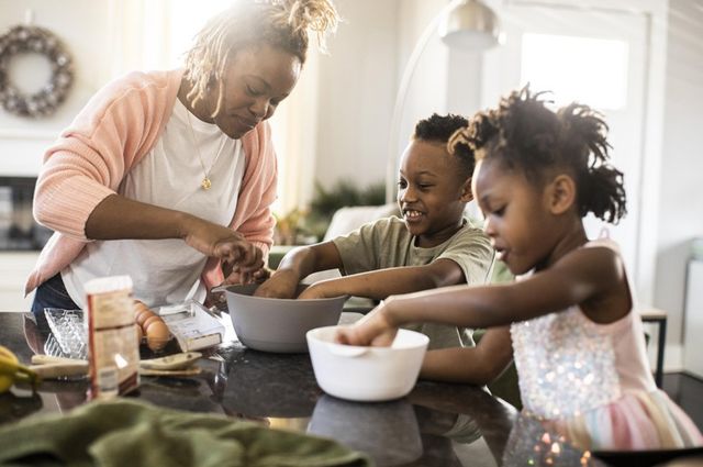 Changes in mothers' brains can last for years.  A mother cooking with her son and daughter