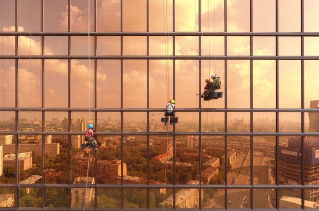 Window cleaners working on the Mercury City Tower in Moscow, Russia.