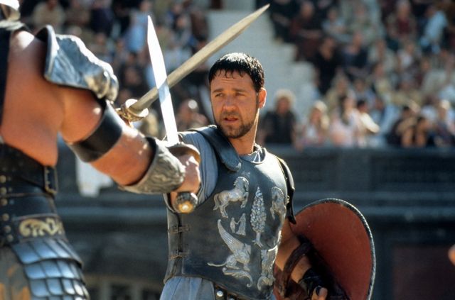 Russell Crowe facing off against another man in a scene from the film 'Gladiator', 2000. (Photo by Universal/Getty Images)