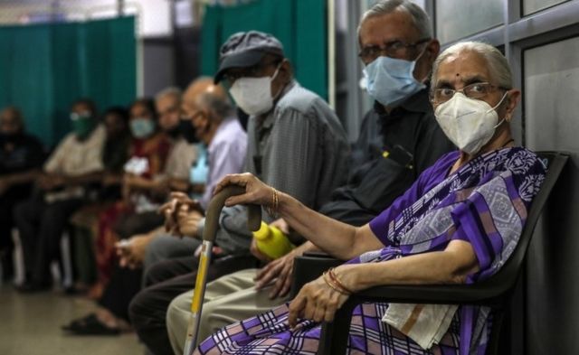 Senior citizens waits to get their first dose of a Covid-19 vaccine shot, manufactured by Serum Institute of India, inside a Vaccination Centre at Shatabdi Hospital in Mumbai, India, 12 March 2021.