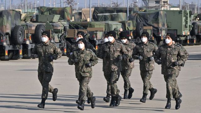 South Korean Army cadets warm up during a training for the Sandhurst Military Skills Competition at Camp Humphreys in Pyeongtaek on February 17, 2022,