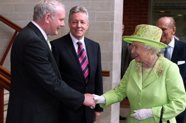 Martin McGuinness shakes hands with the Queen