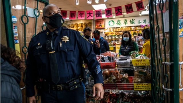 Police presence outside a San Francisco Asian grocery store due to increased violence