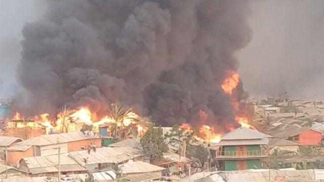 Plumes of smoke and fire in the camp