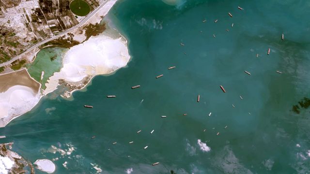 Satellite images show ships waiting to cross the Suez Canal.
