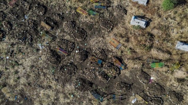 aerial view taken on November 21, 2020 shows a cemetery where alleged victims of the November 9, 2020 massacre were buried in collective graves, in Mai Kadra, Ethiopia