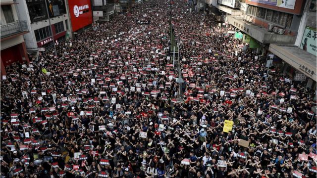 Thousands of protesters dressed in black take part in a new rally