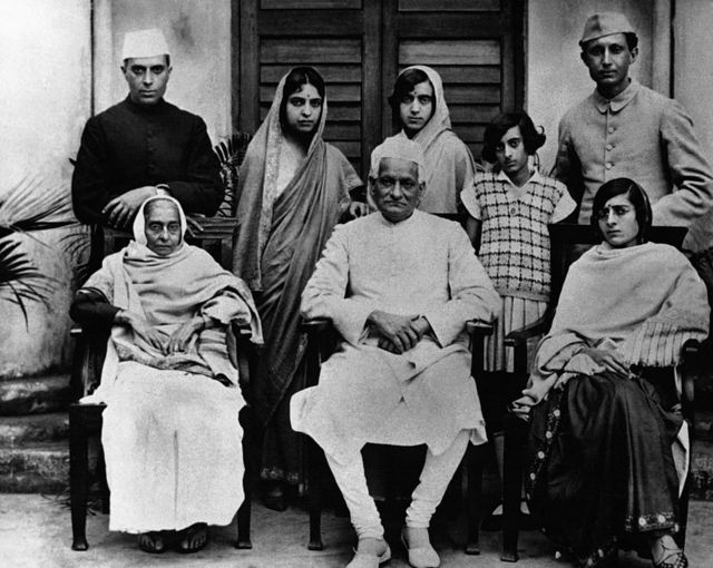 Nehru family photo with on the right, Indira as a schoolgirl, her father Jawaharlal on the far left and in the center the grandfather Motilal Nehru, in India circa 1920.